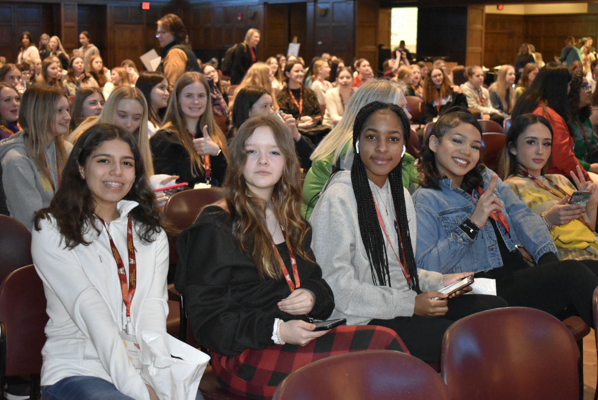 Students posing before the keynote speaker at Go Further