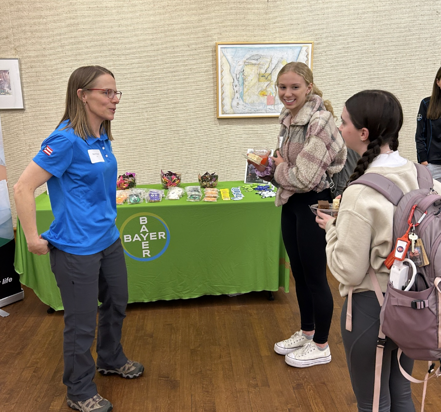 Bayer representative talking with students
