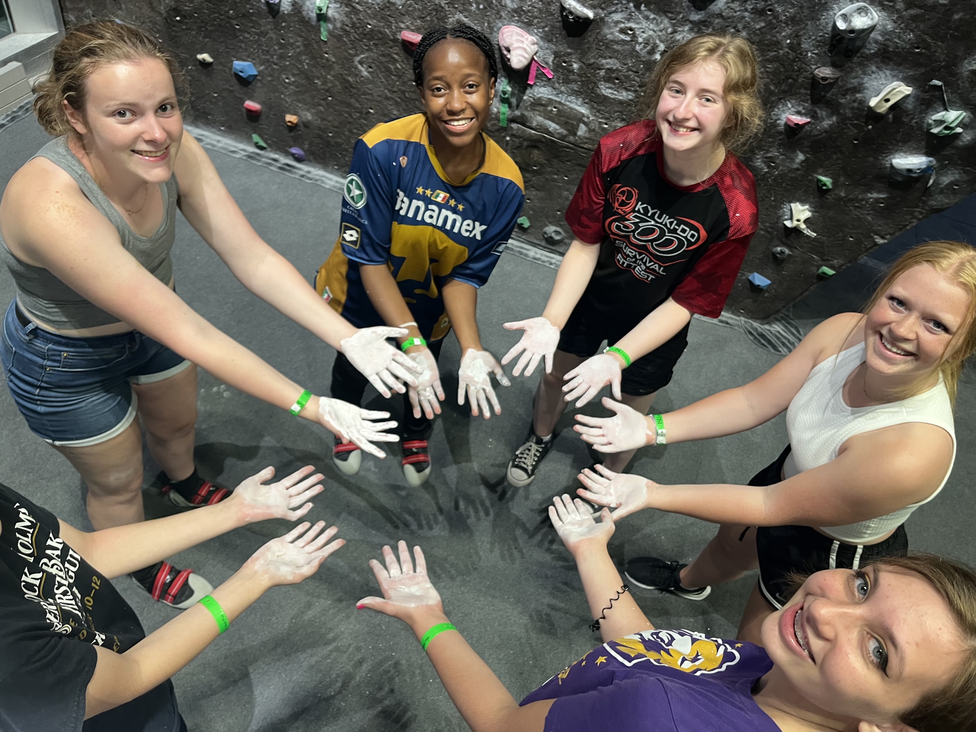 Students showing their hands after rock climbing