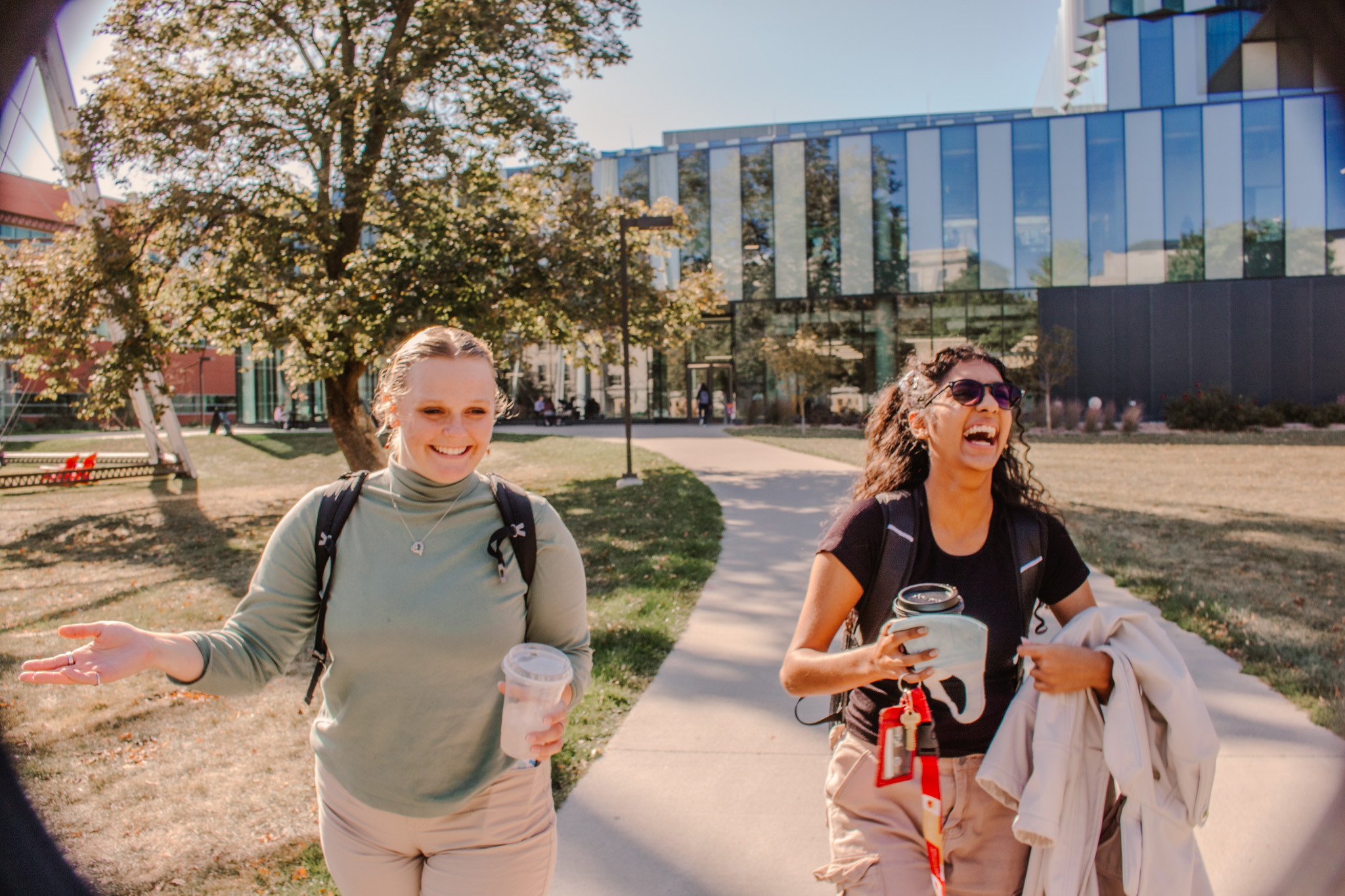 Students walking and laughing.