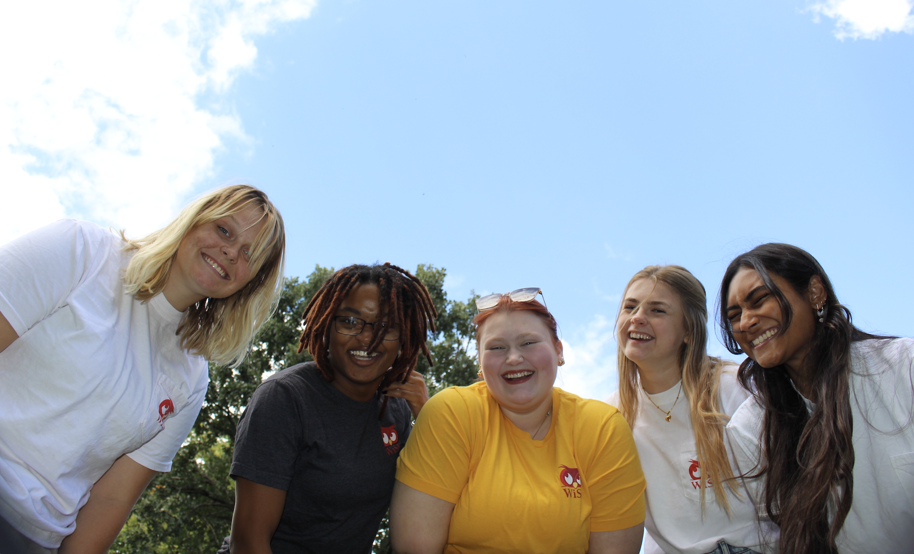 Students smiling down at the camera